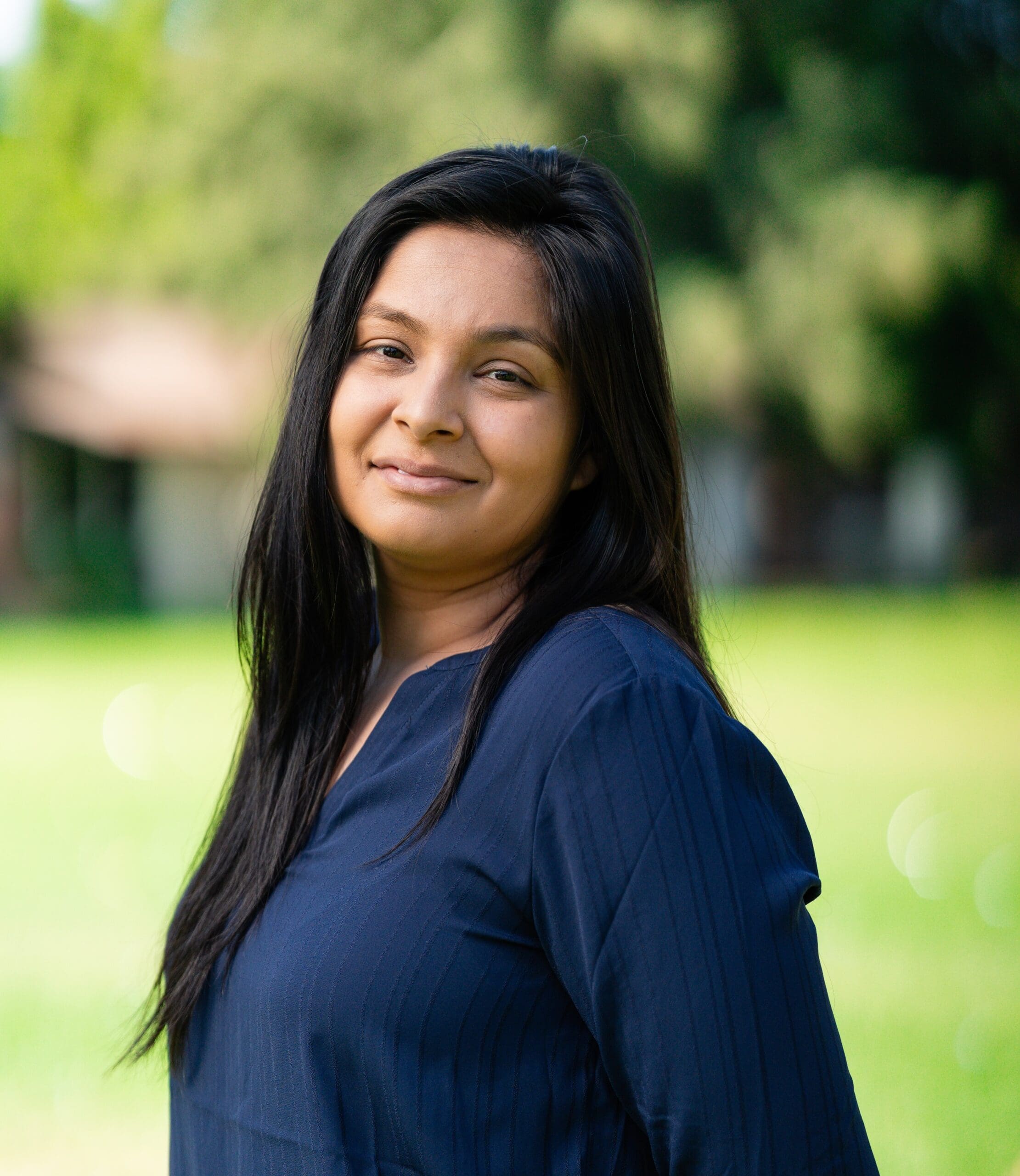 Professional headshot of Jorgina Lazcano against a neutral background