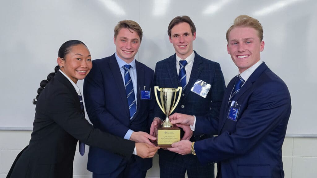 Menlo students hold a winning trophy.