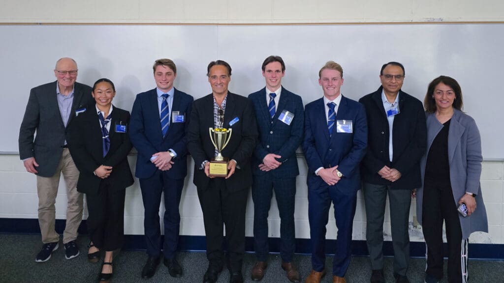 Menlo students and faculty pose with the winning trophy.