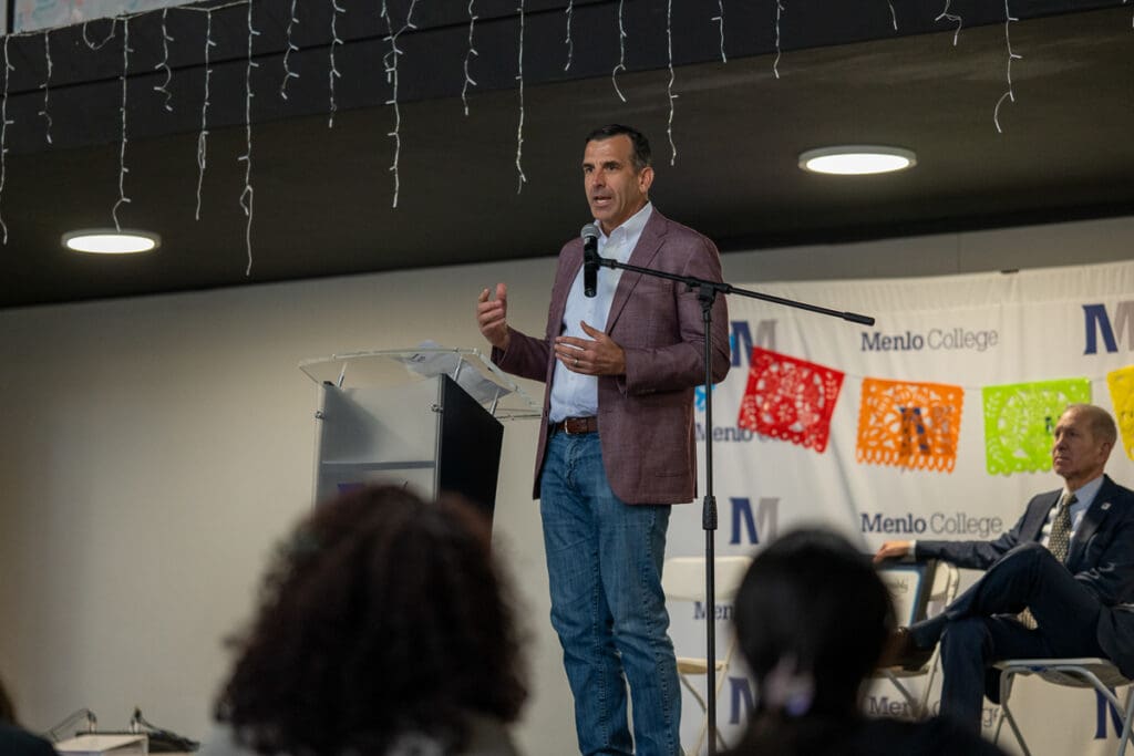 Guest speaker is addressing a crowd of students.