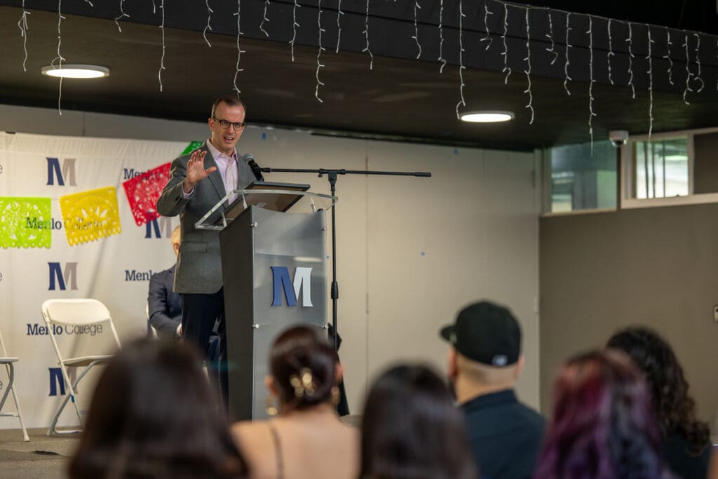 Guest speaker is addressing a crowd of students.