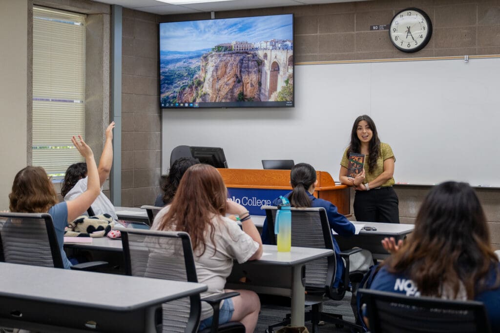 Professor Peña teaching inside a classroom at Menlo College, Atherton.