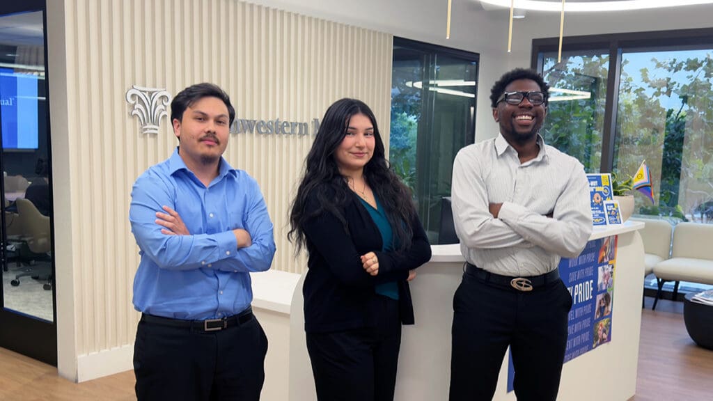 Menlo College students Alexander Gee, Jessica Oseguera Santoyo, and Andrue Perkins stand together at the Northwestern Mutual office during their summer internships.
